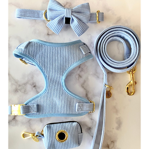 our pawder blue collection includes minimalistic luxury corduoy dog harness, dog collar, dog leash, poop bag holder and bow ties